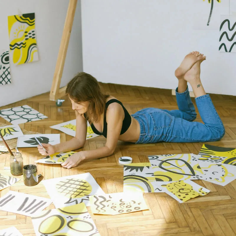 Artist working on the floor